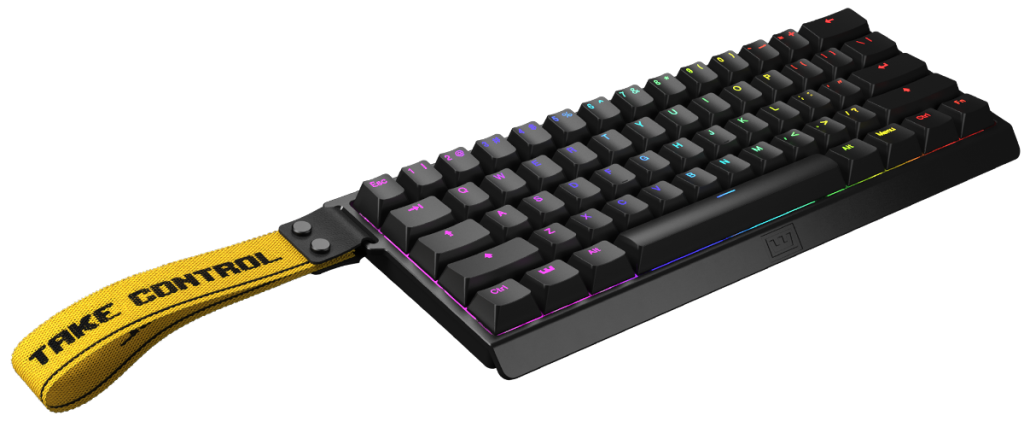 Wooting 60HE gaming keyboard used by Mathieu 'ZywOo' Herbaut, featuring a compact 60% layout, analog input technology, customizable RGB lighting, and a signature yellow 'Take Control' strap—designed for peak CS2 performance and pro-level responsiveness.