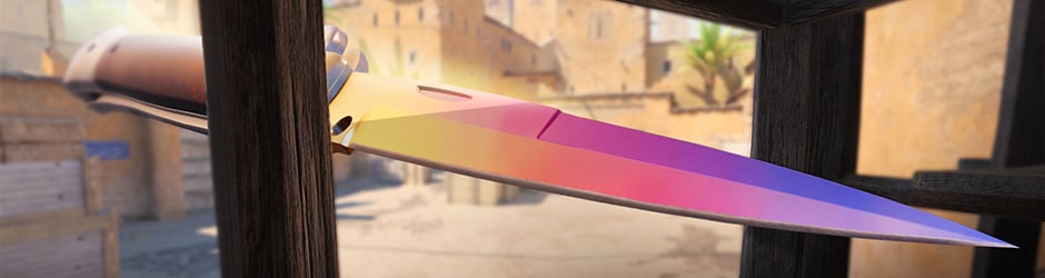 Stiletto Knife Fade in CS2 – bright pink, orange, and blue tones with reflective finish, premium Covert skin from Horizon Case